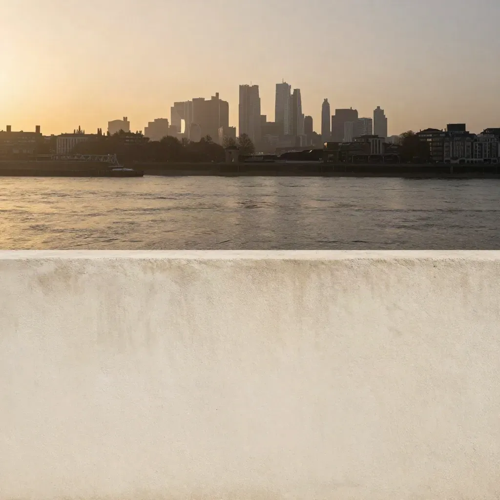 South London skyline above warm haze over a calm pale concrete surface